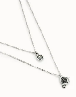 Colgante bañado en plata de ley con doble cadena y corazones con cristal negro