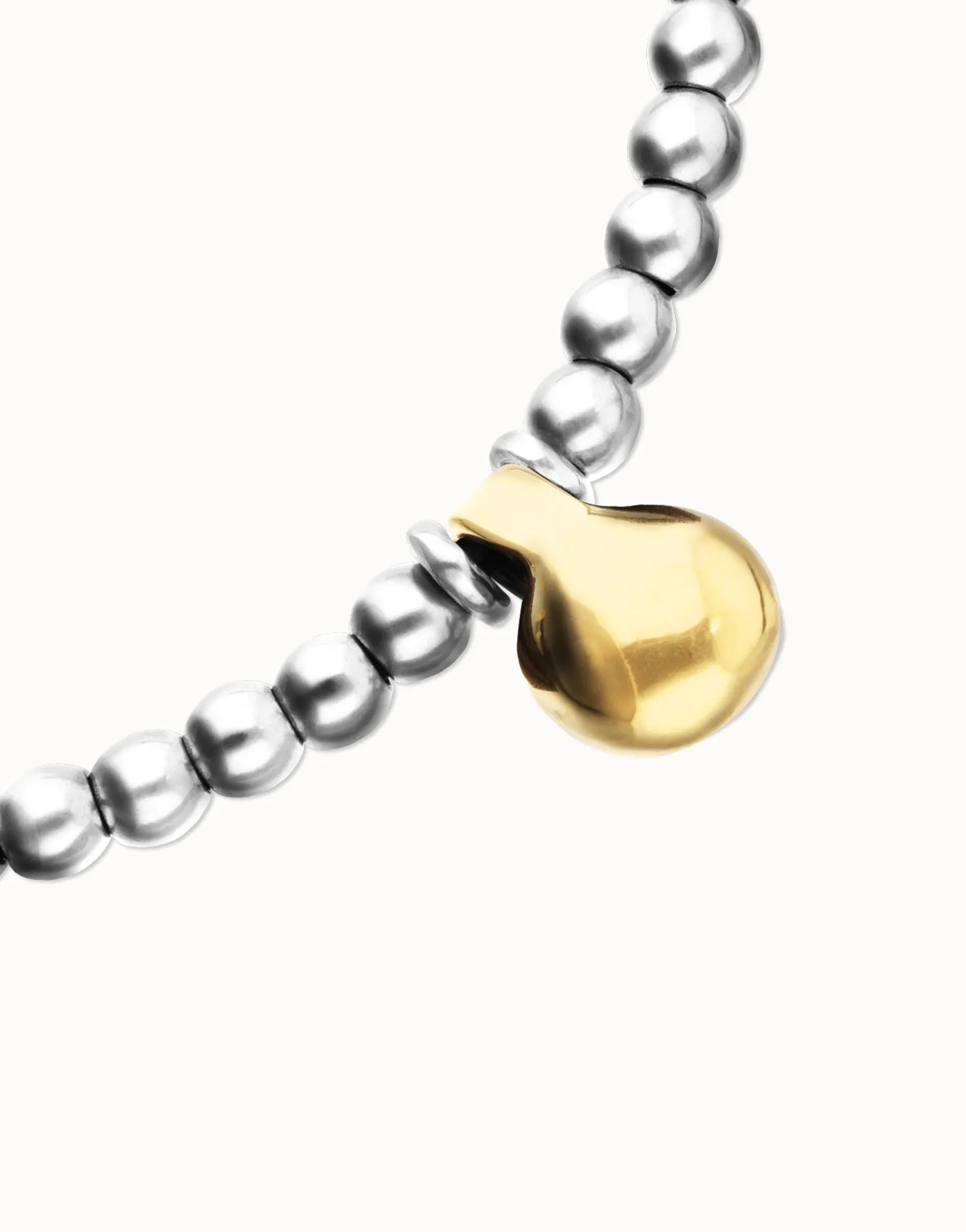 Collar de esferas medianas bañadas en plata de ley y esfera grande en oro 18k