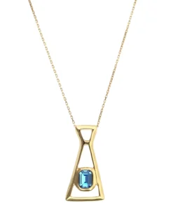 Collar largo con colgante bañado en oro 18k y cristal facetado rectangular azul