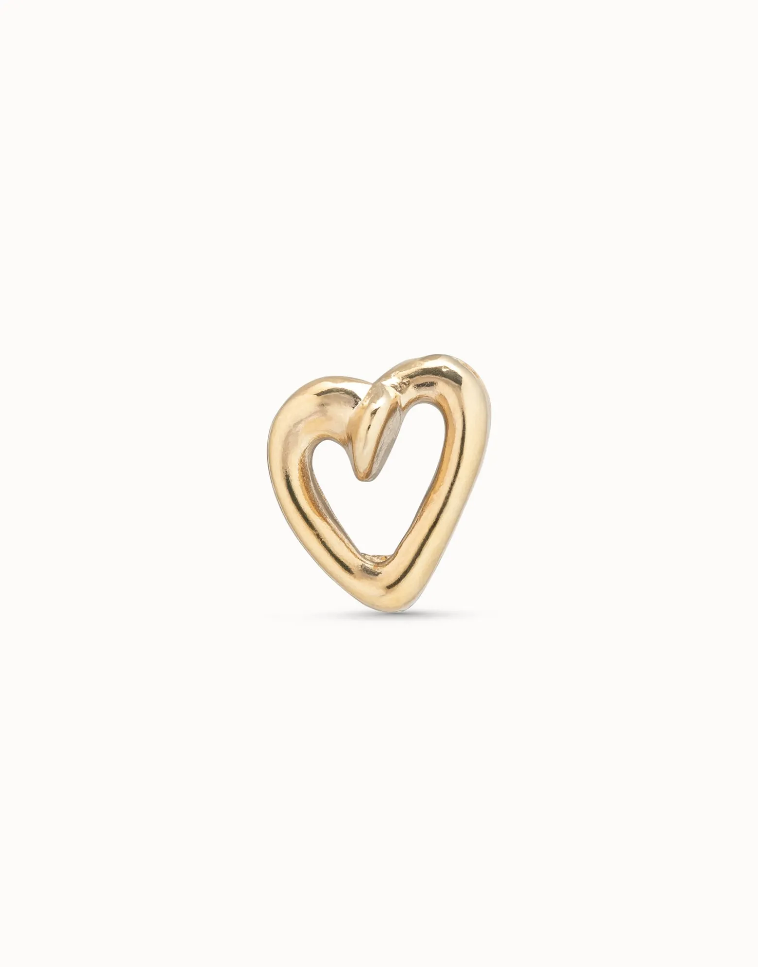 Piercing bañado en oro de 18k de ''corazón clavado''