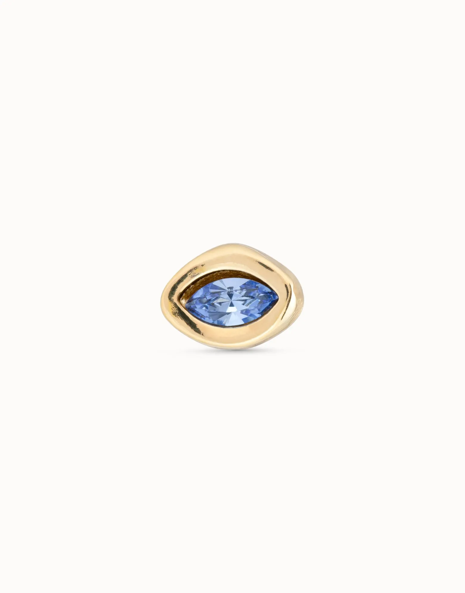 Piercing bañado en oro de 18k y un cristal azul