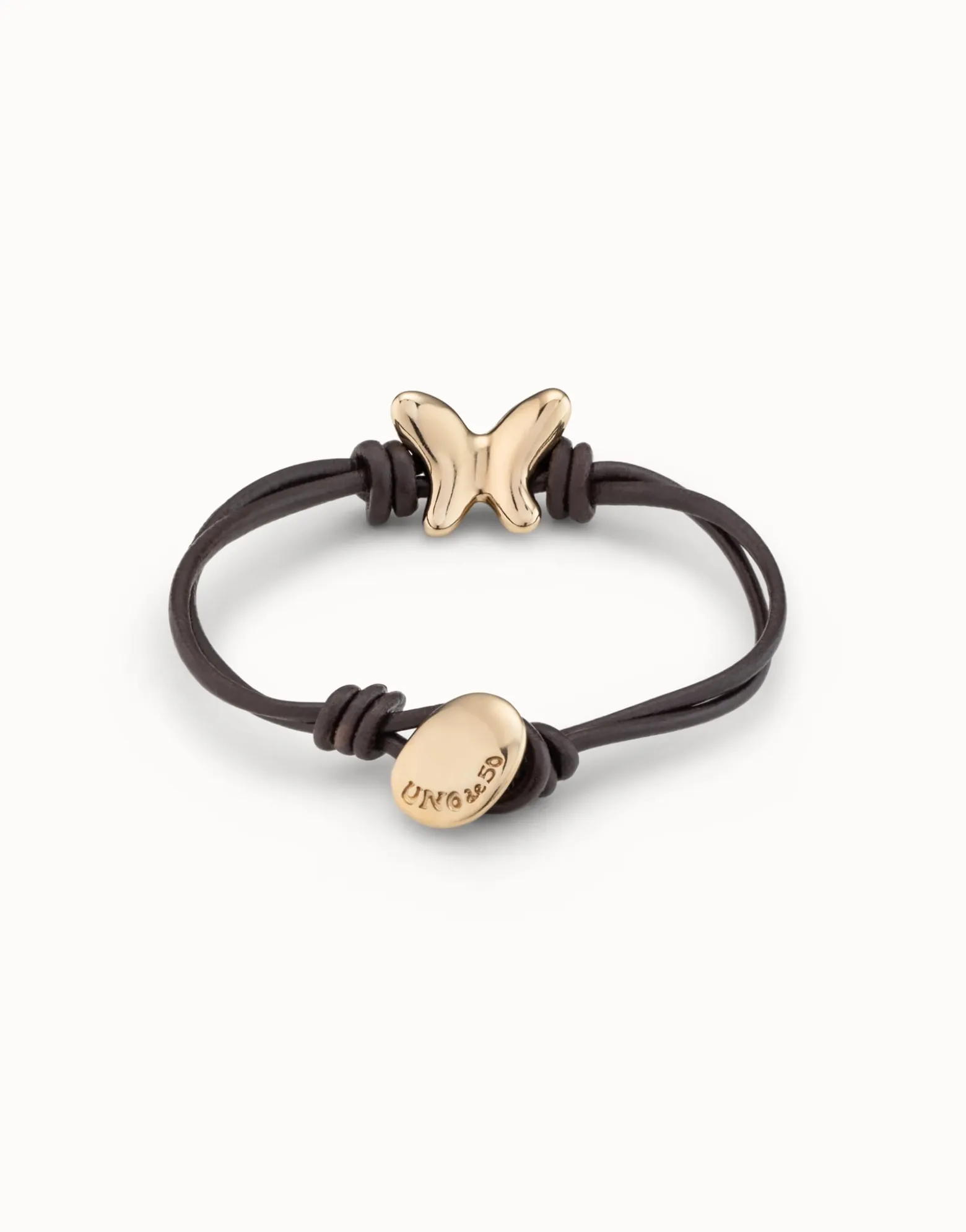 Pulsera con tiras de cuero bañada en oro 18K
