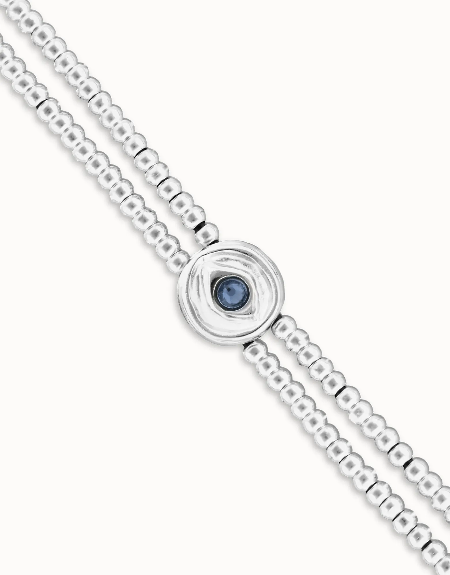 Pulsera de bolas doble bañada en plata de ley con detalle de ojo y cristal azul