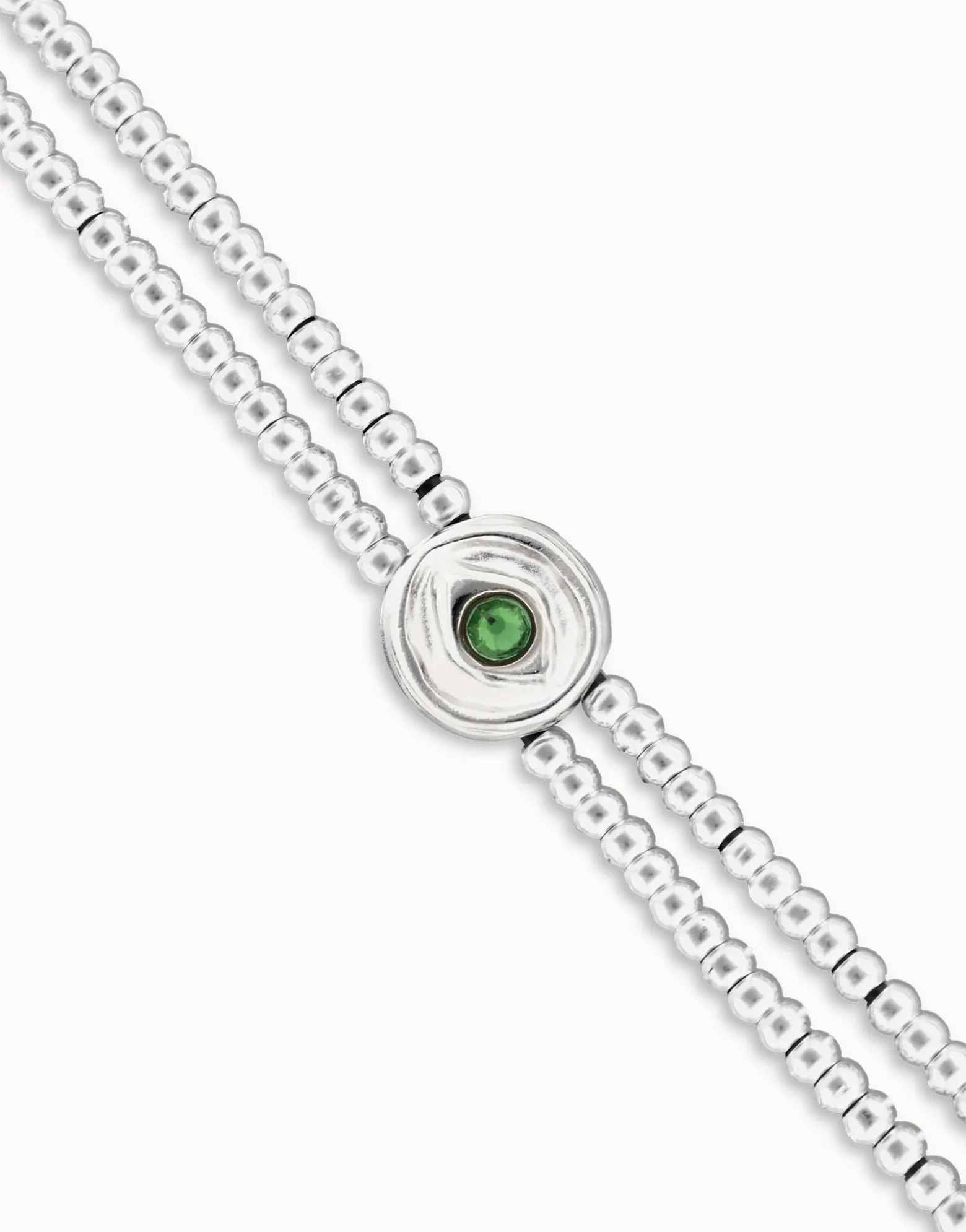 Pulsera de bolas doble bañada en plata de ley con detalle de ojo y cristal verde