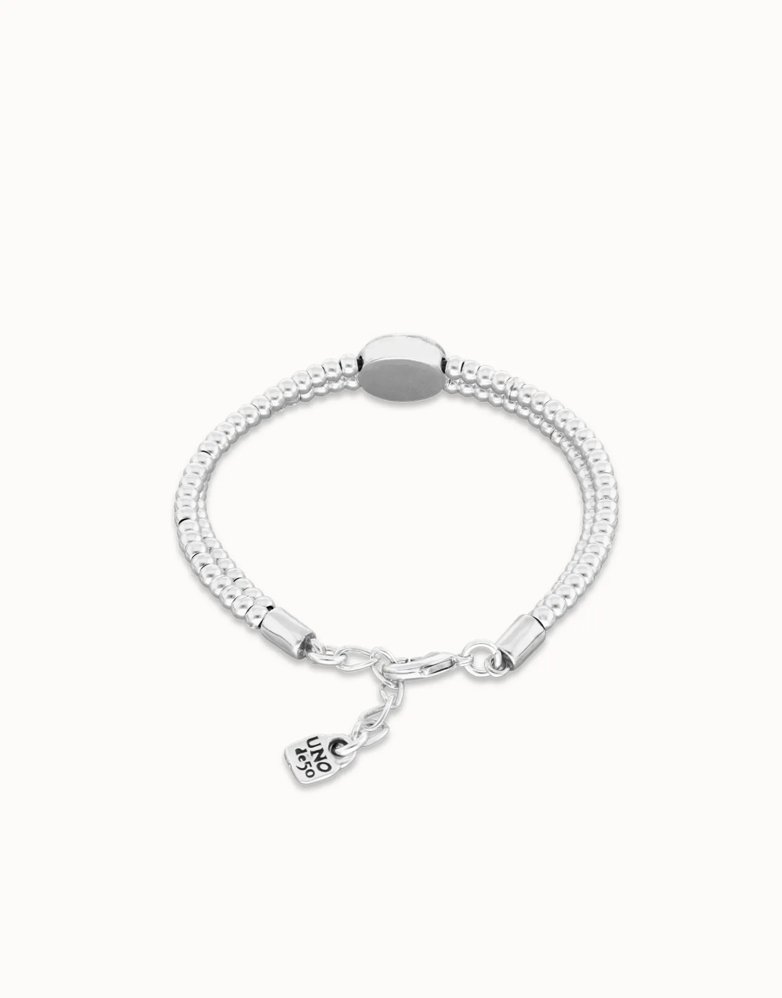 Pulsera de bolas doble bañada en plata de ley con detalle de ojo y cristal verde