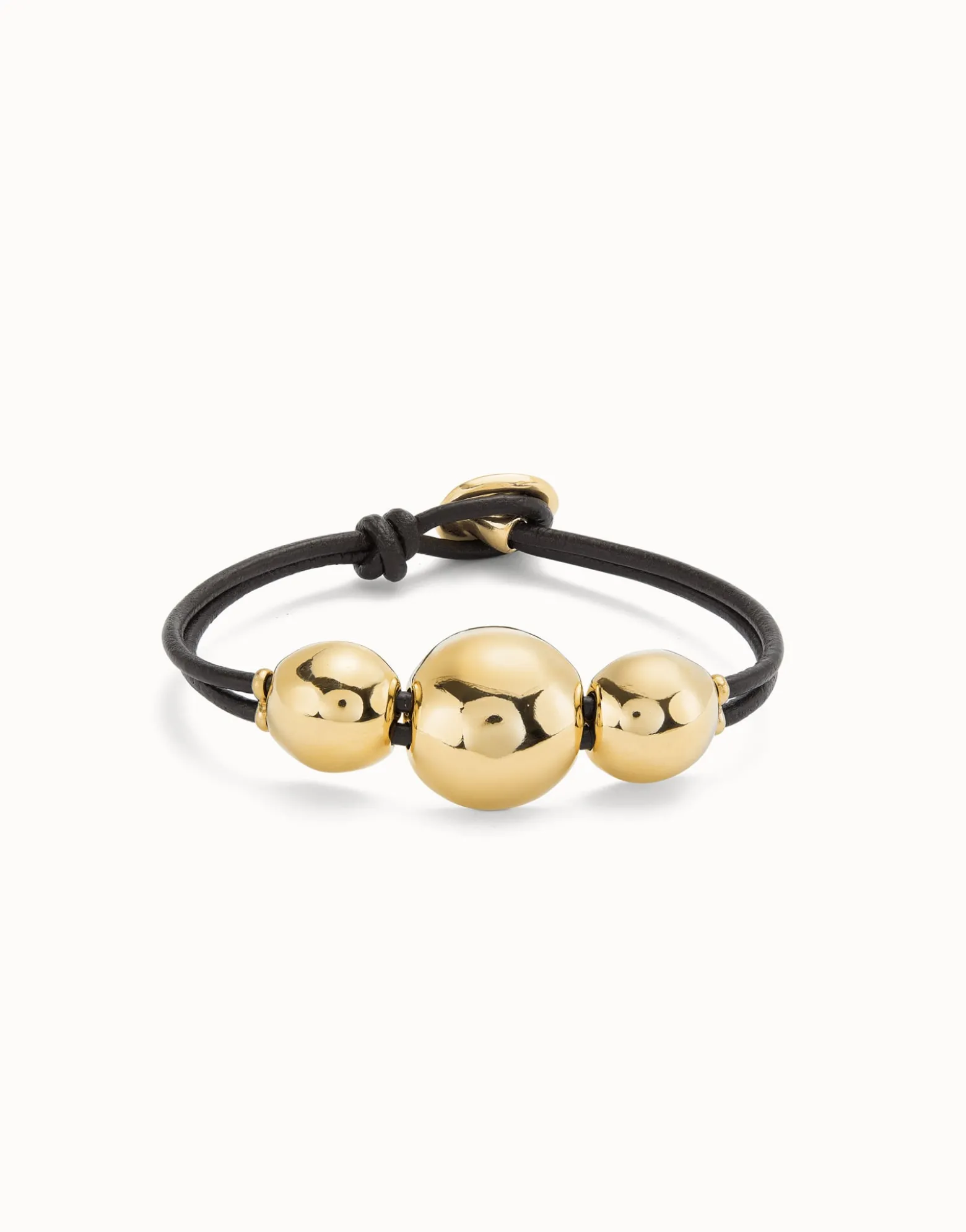Pulsera de cuero con tres bolas grandes bañadas en oro 18k