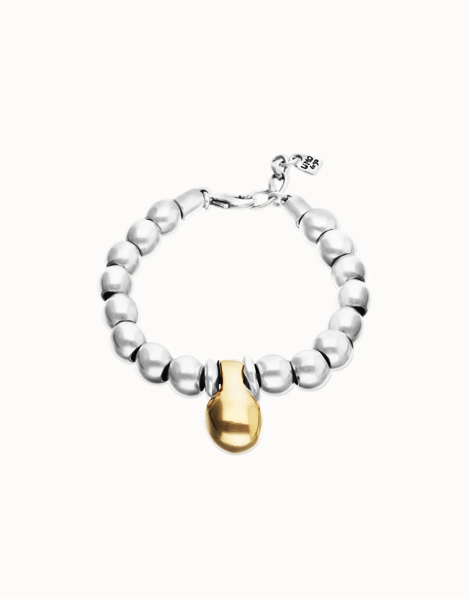 Pulsera de esferas medianas combinando baño en oro y en plata