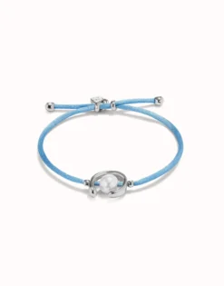 Pulsera de hilo azul con perla shell fornitura bañada en plata de ley.