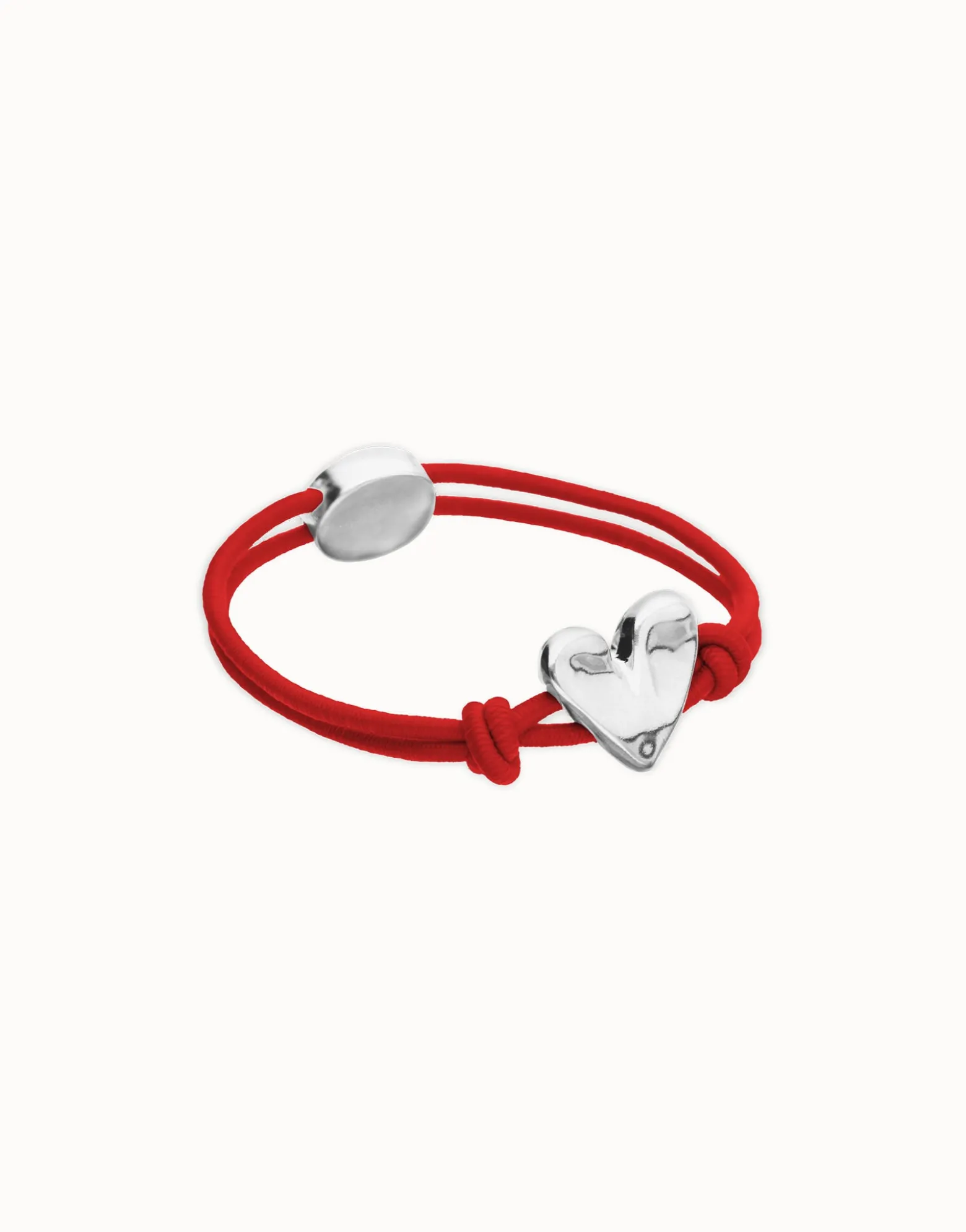Pulsera de hilo elástico rojo con corazón bañado en plata de ley