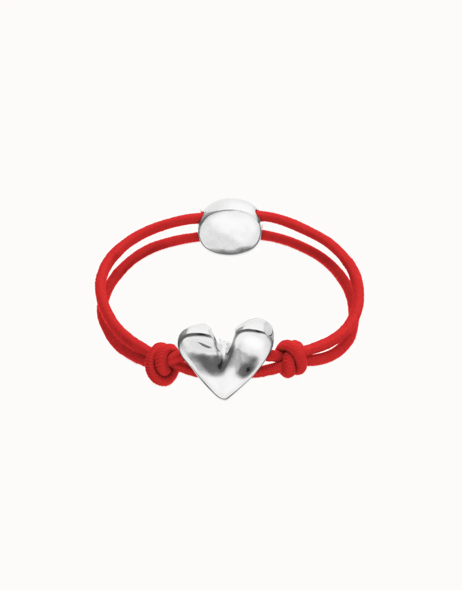 Pulsera de hilo elástico rojo con corazón bañado en plata de ley