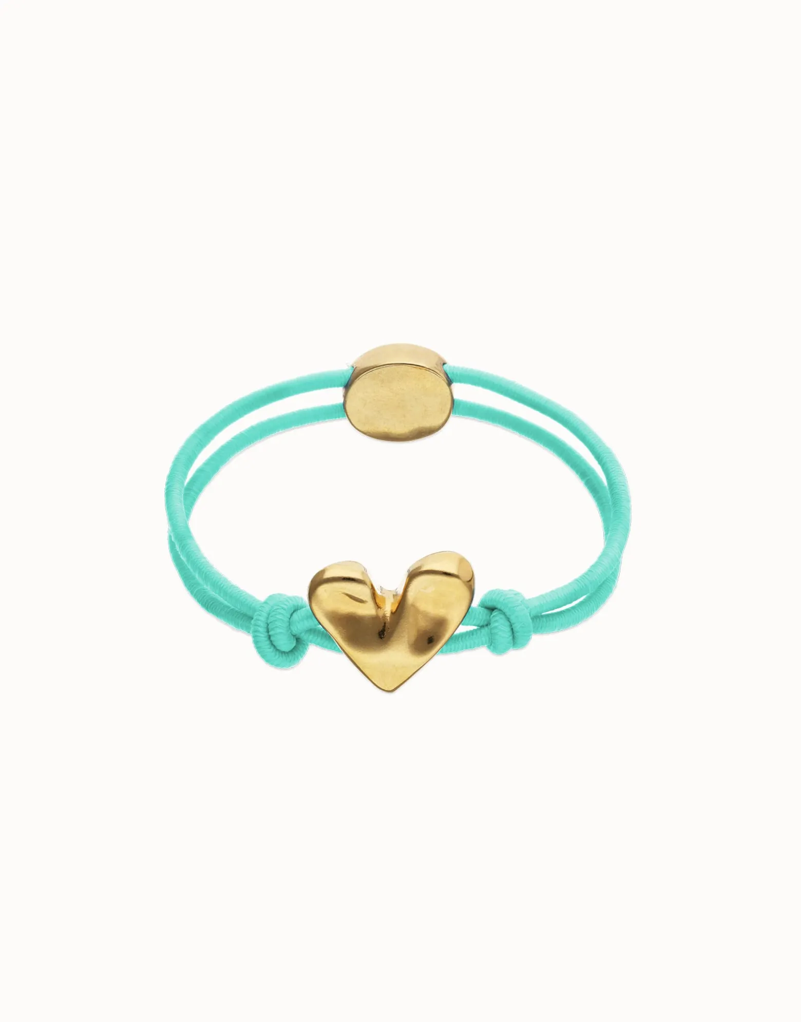 Pulsera de hilo elástico turquesa con corazón bañado en oro 18k