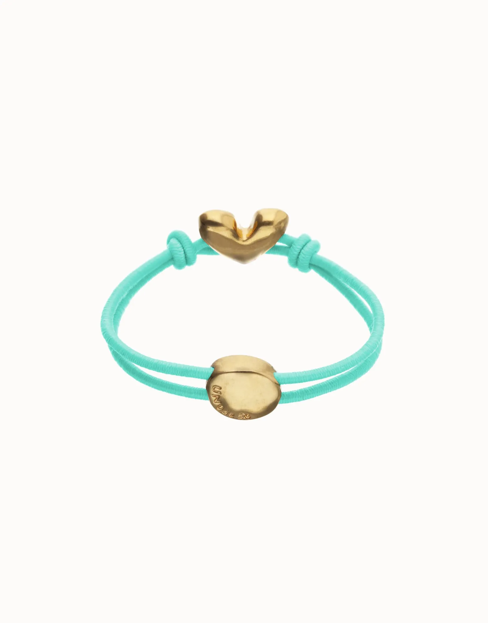 Pulsera de hilo elástico turquesa con corazón bañado en oro 18k