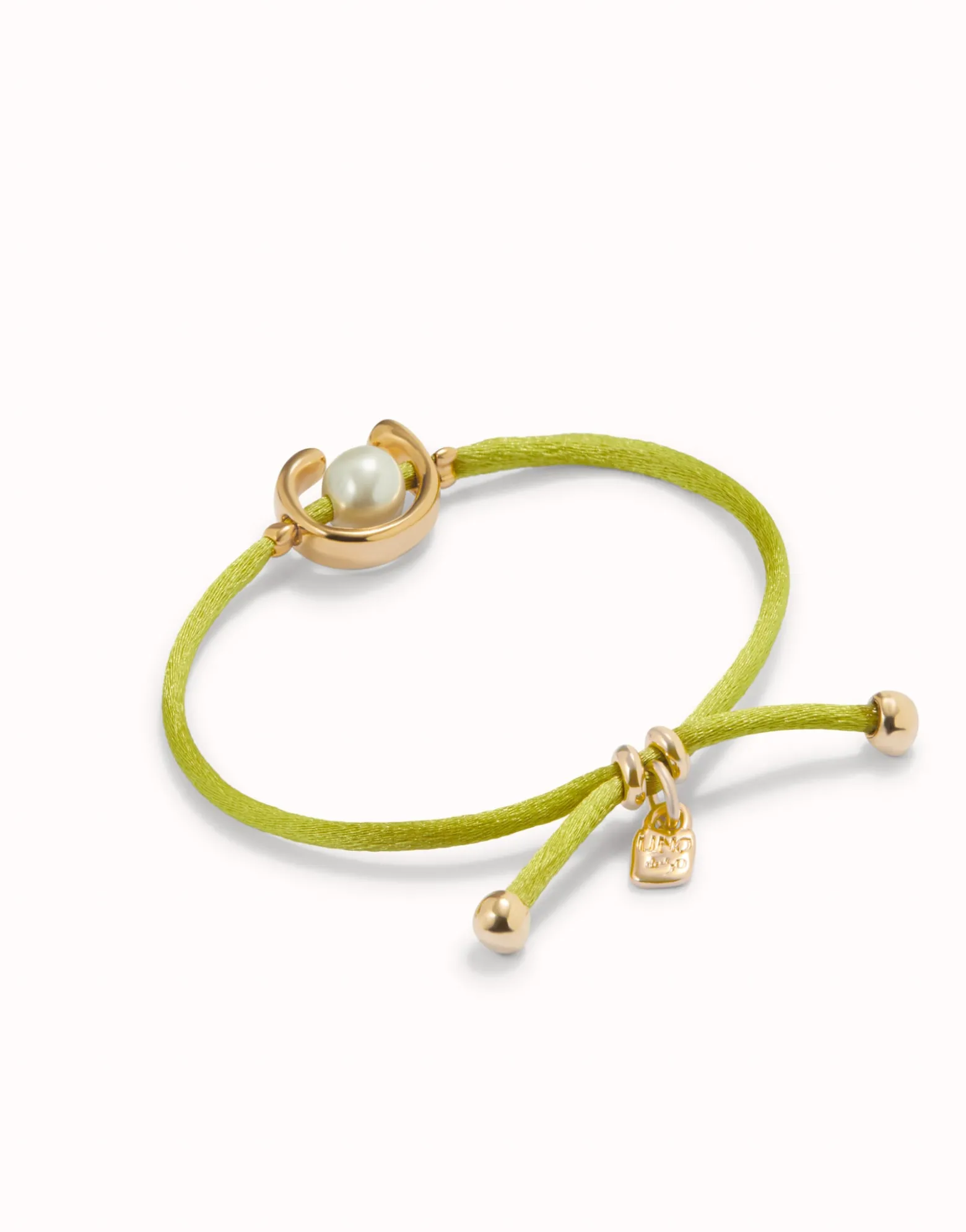 Pulsera de hilo lima con perla shell fornitura bañada en oro 18k.