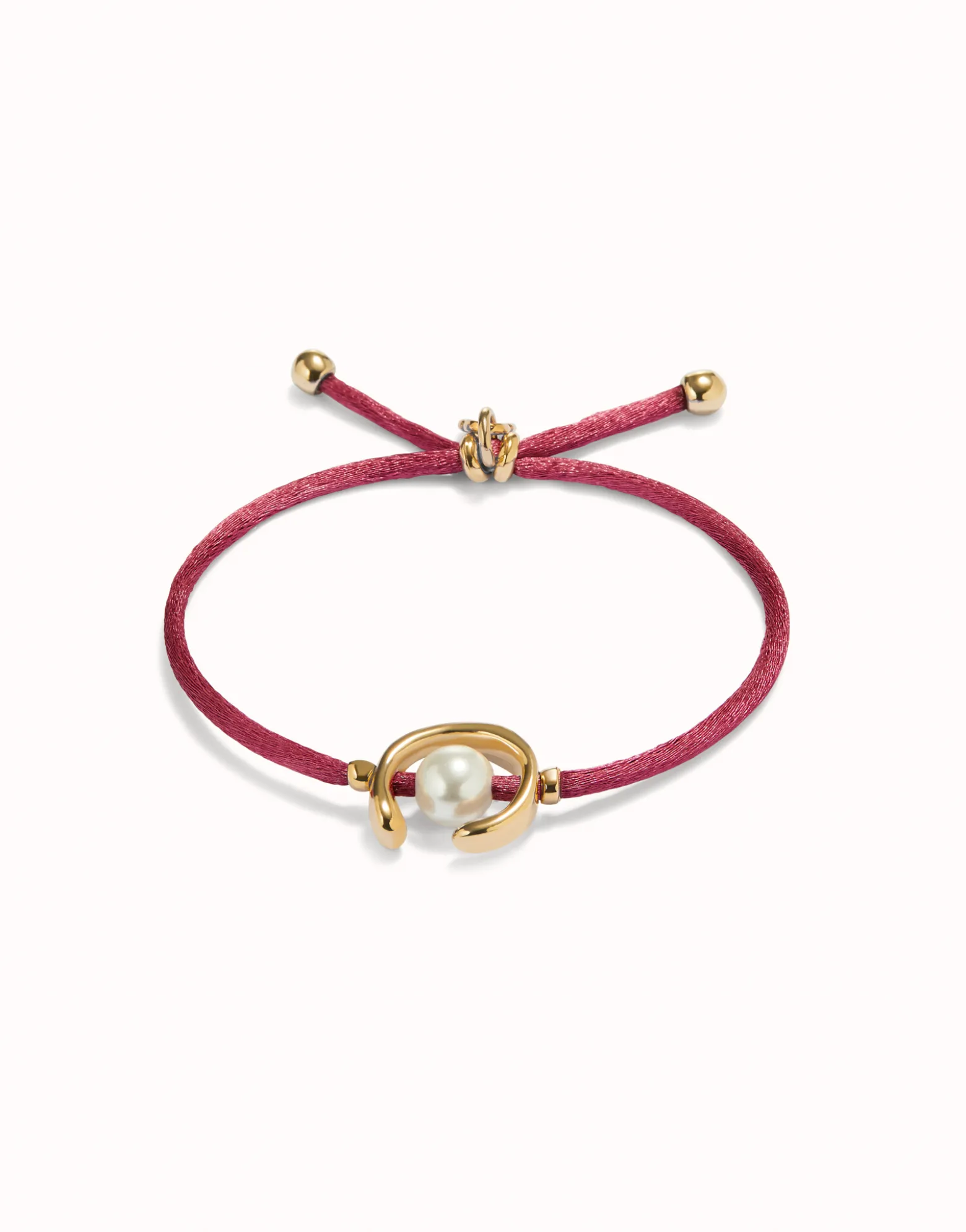 Pulsera de hilo malva con perla shell fornitura bañada en oro 18k.