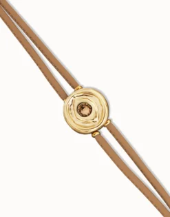 Pulsera doble de cuero crema con ojo bañado en oro 18k