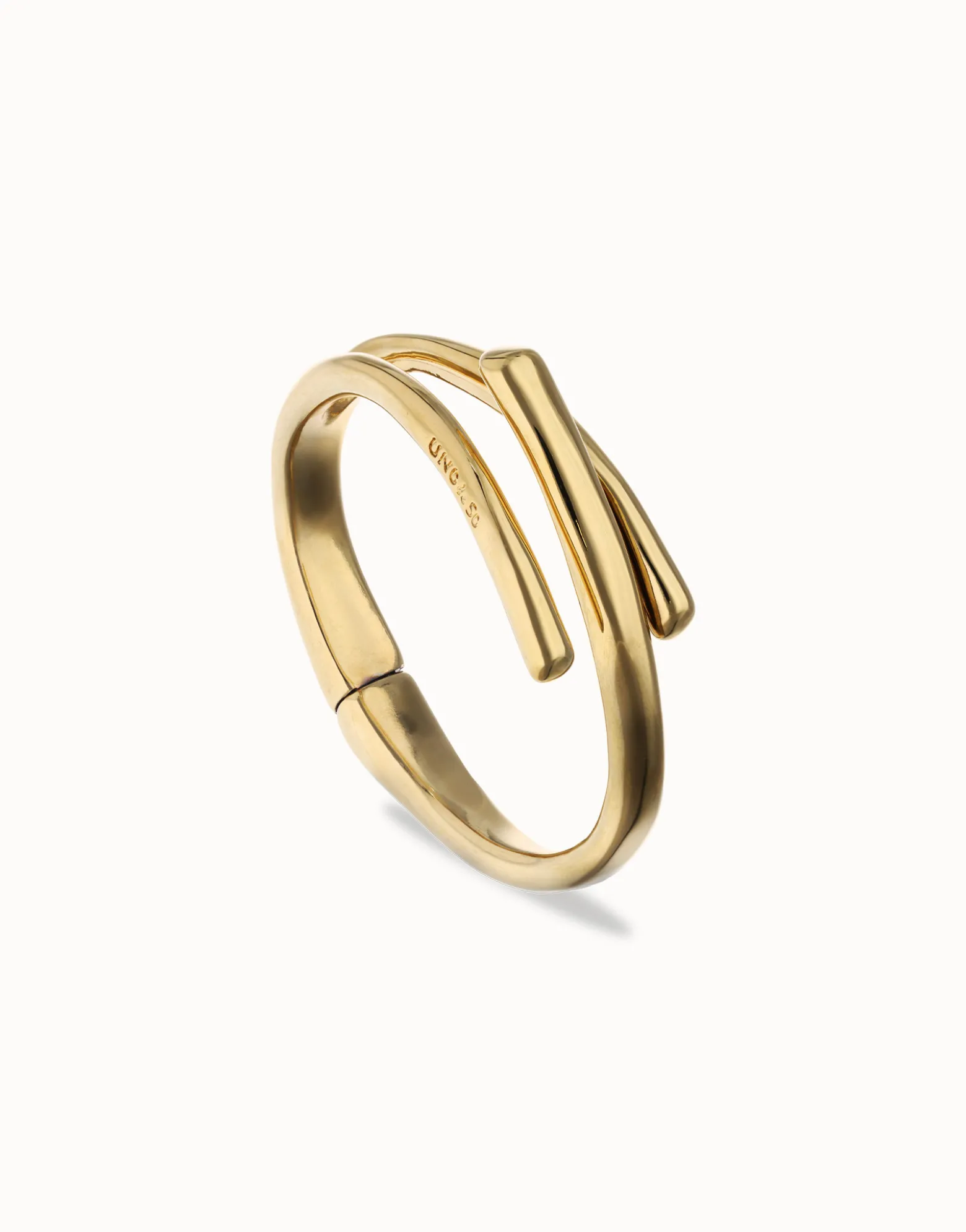 Pulsera rígida bañada en oro 18k con tres formas orgánicas entrelazadas