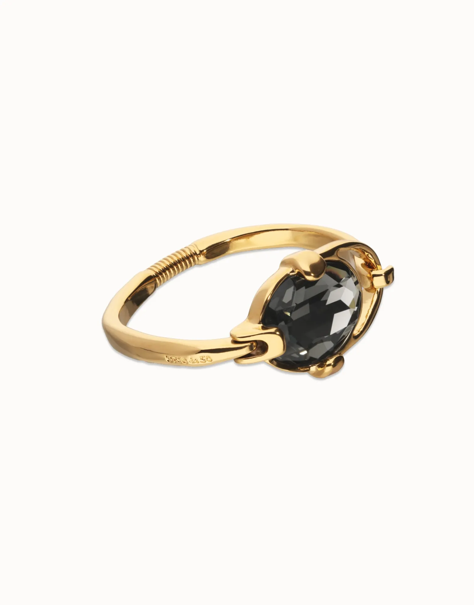 Pulsera rígida bañada en oro 18k con cristal facetado ovalado gris