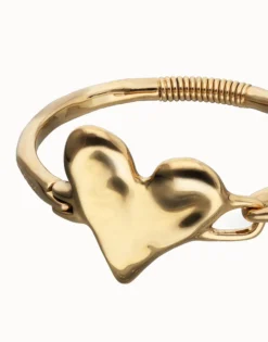 Pulsera semirrígida bañada en oro 18k y detalle de corazón